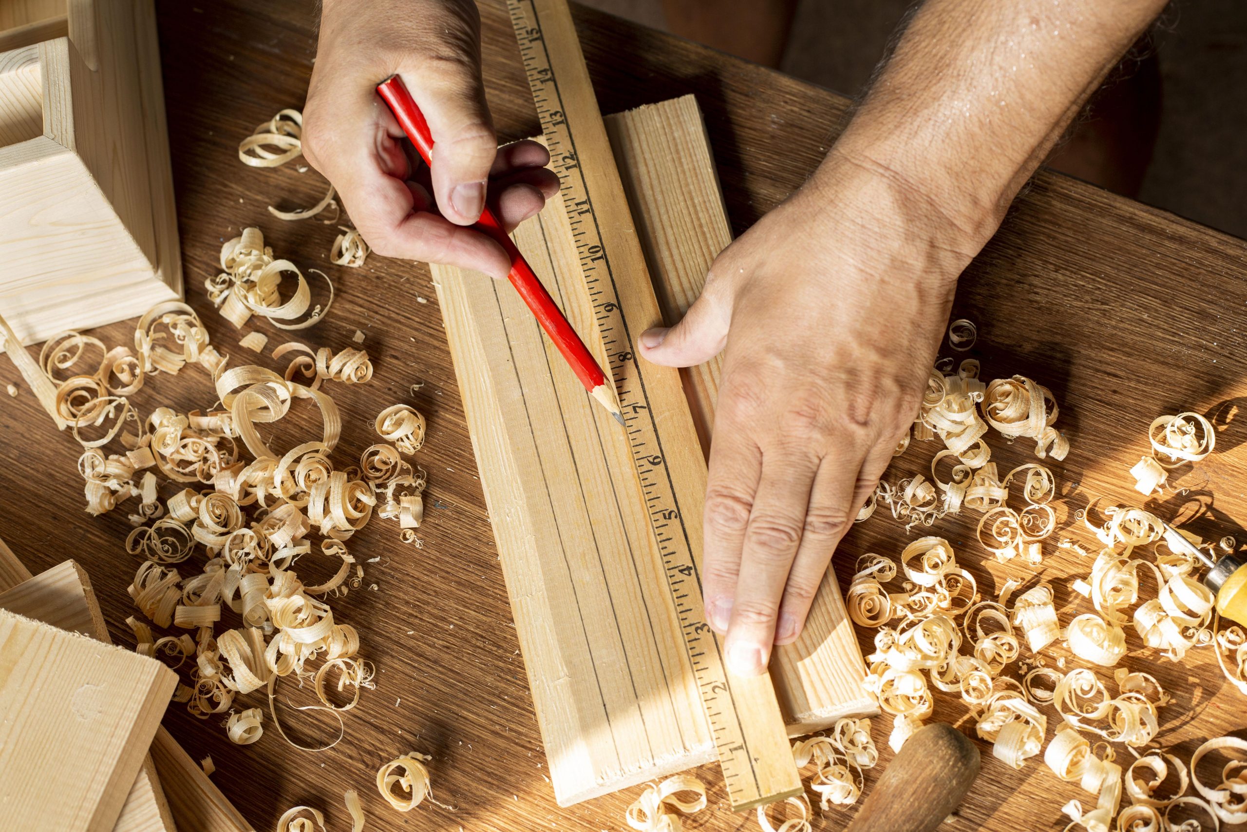carpenter-measuring-with-ruler-and-pencil